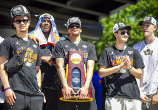 The Gator boys show off trophy at Championship Rally on Flavet Field in Gainesville, Fla., on Tuesday, April 8, 2025. (Photo by Hanna Maglio)