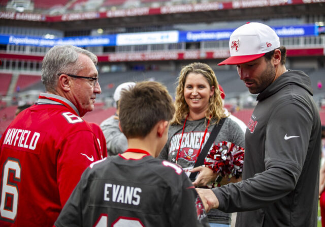 Baker Mayfield, 6, fist bumps a fan before a game at Raymond James Stadium in Tampa, Fla., on Saturday, August 23, 2025. (Photo by Hanna Maglio)